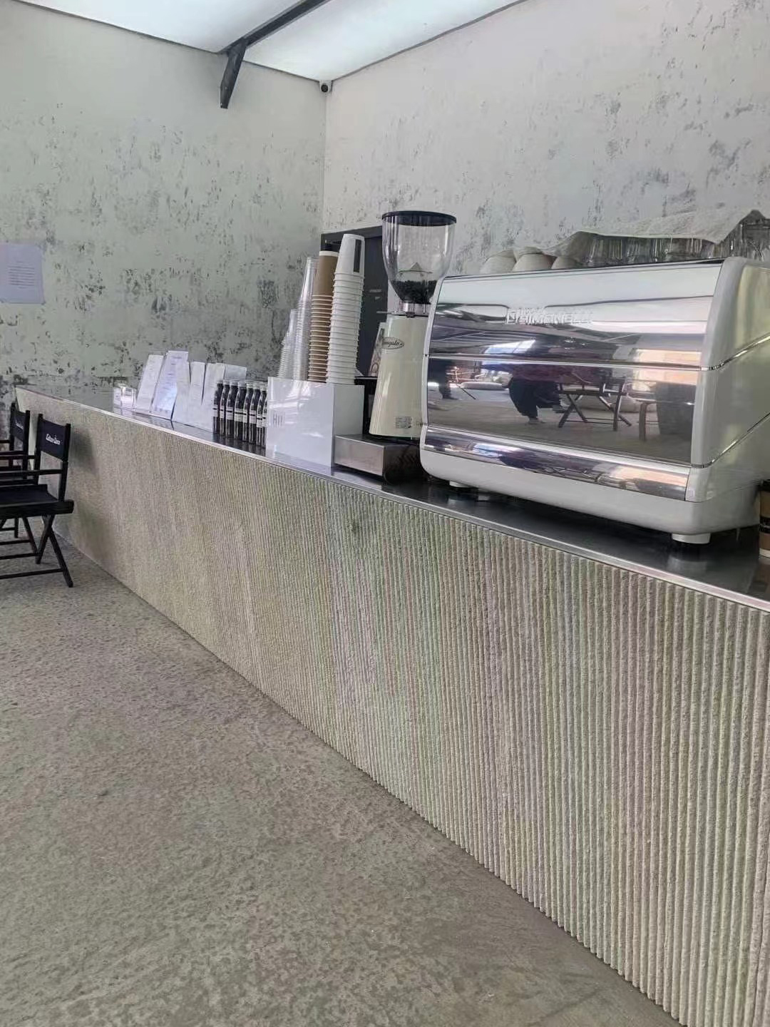 Client-supplied commercial counter finished with a lined mineral surface